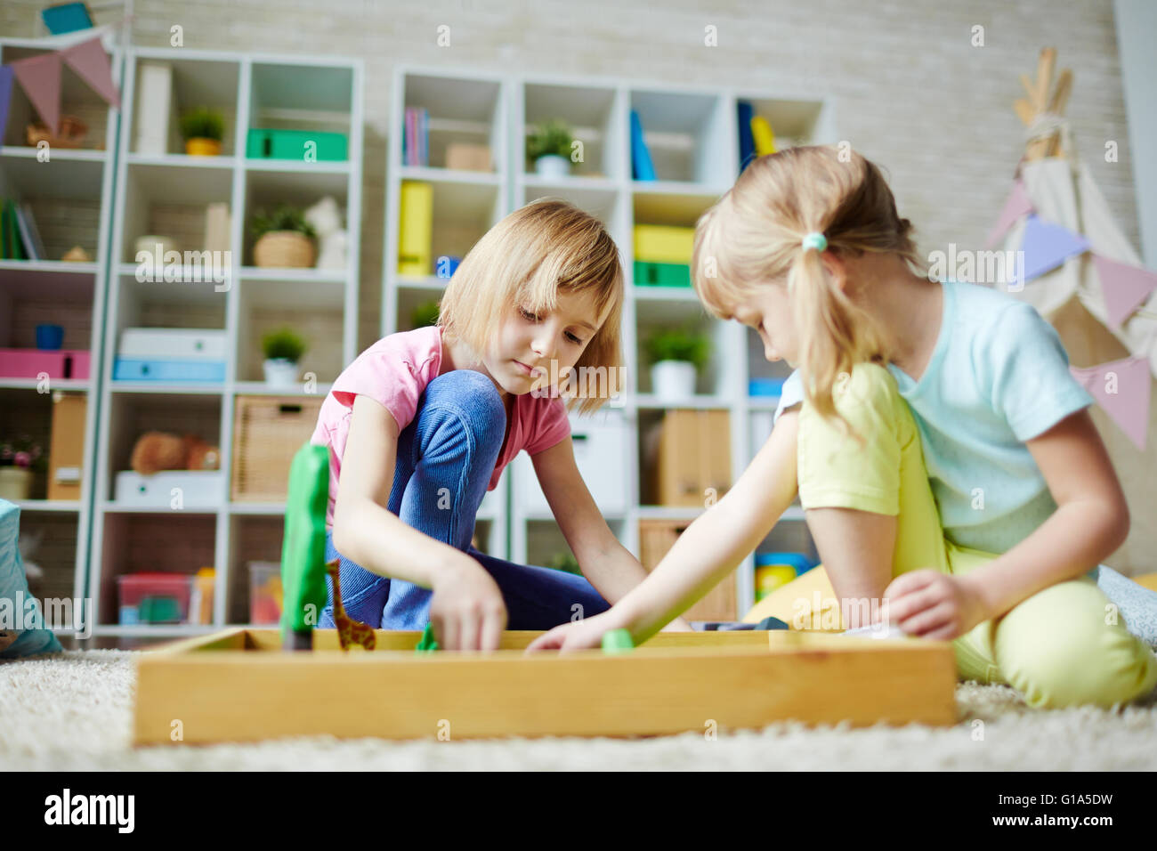 Adorable girls playing in kindergarten Stock Photo - Alamy