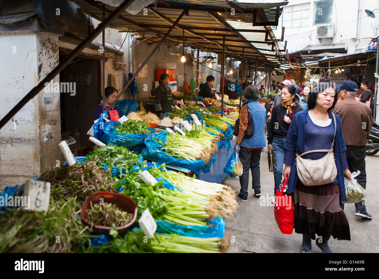 Chinese people shopping at the outdoor food market with vegetables at Nanjing in China Stock Photo