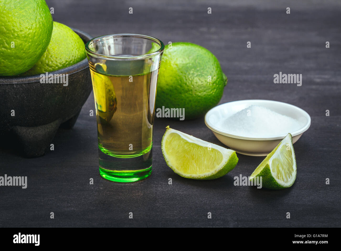 tequila , lime and salt on black table Stock Photo Alamy