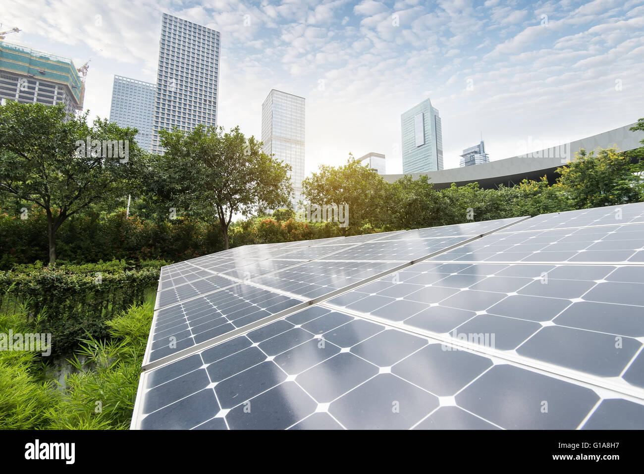 Solar Panels In The Park Of Modern City Stock Photo