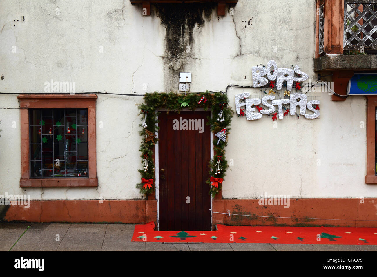 Boas Festas greeting and Christmas decorations outside house, Vila Praia de Ancora, Minho Province, northern Portugal Stock Photo