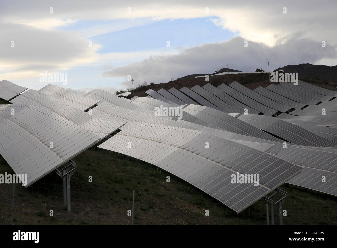 Array of solar panels on a grey overcast day, Sierra Alhamilla, near Nijar, Almeria, Spain Stock Photo