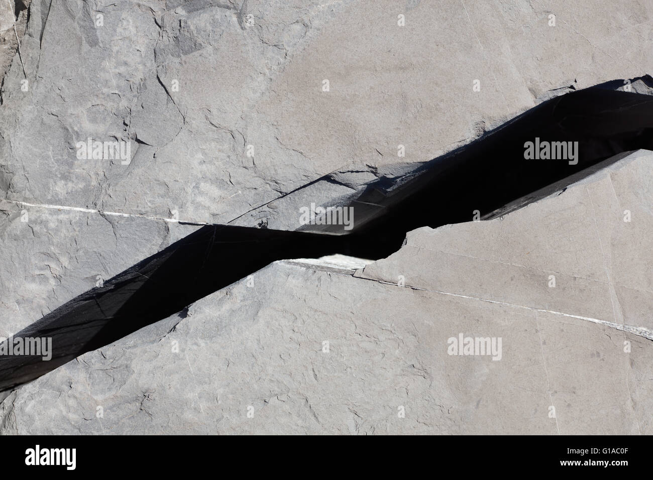 Crack in a gray stone texture background Stock Photo