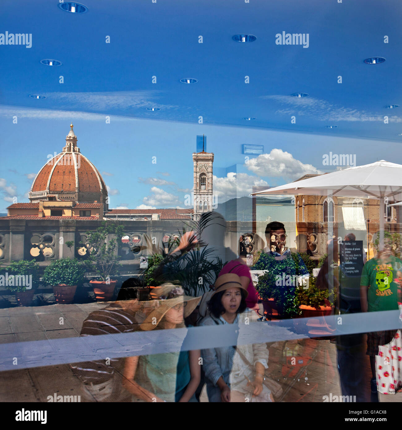 reflection of Florence Duomo and Campanile in window at ufizzi roof top cafe, Florence’s cathedral complex Stock Photo