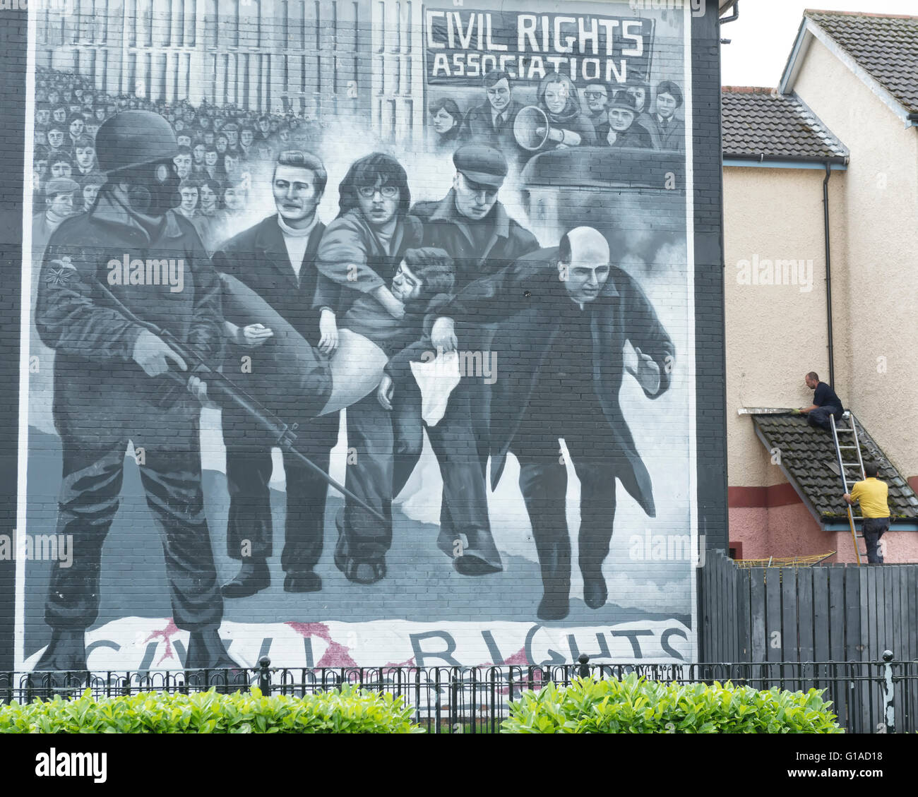 The Bloody Sunday mural showing catholic priest Edward Daly (later to become Bishop Daly) waving a white handkerchief. Derry Londonderry. N Ireland Stock Photo