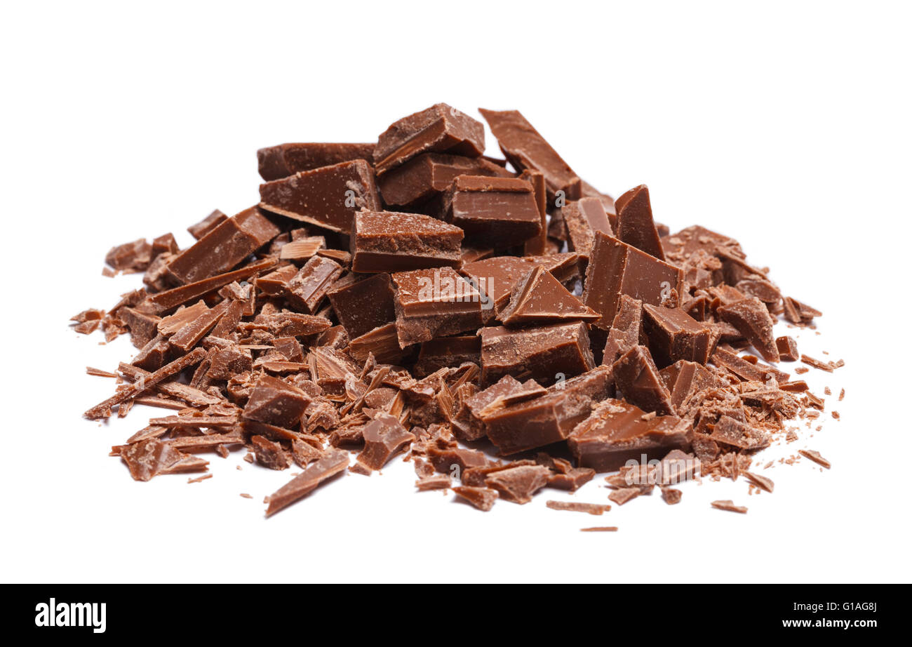 Pile of Broken and Shaved Chocolate Pieces Isolated on White Background. Stock Photo