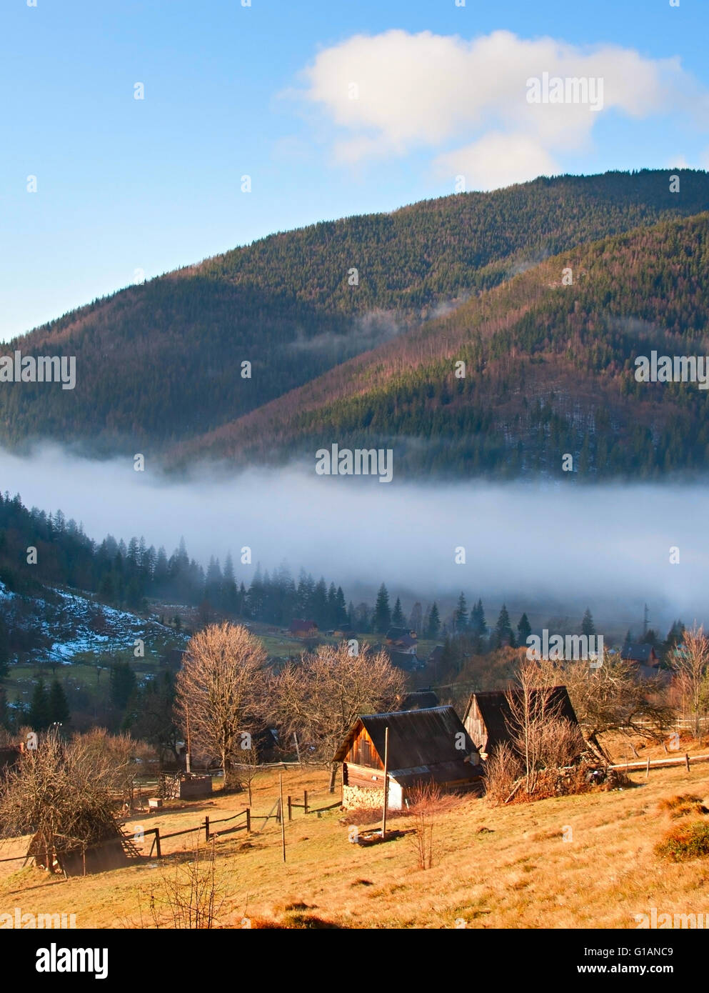 Old Carpathians mountains village in a morning mist Stock Photo - Alamy