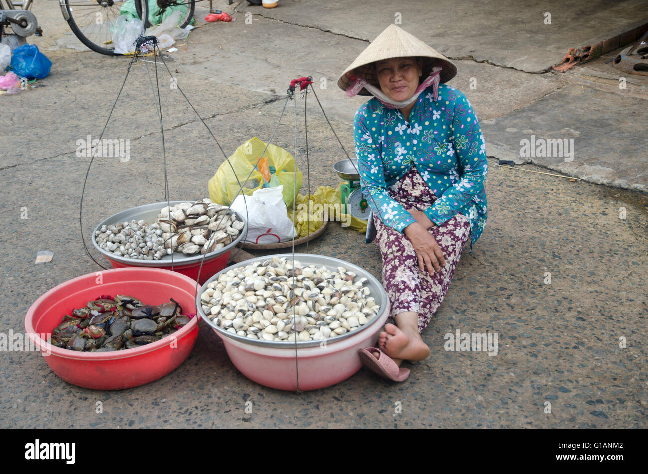Seller at My Tho market, Vietnam Stock Photo