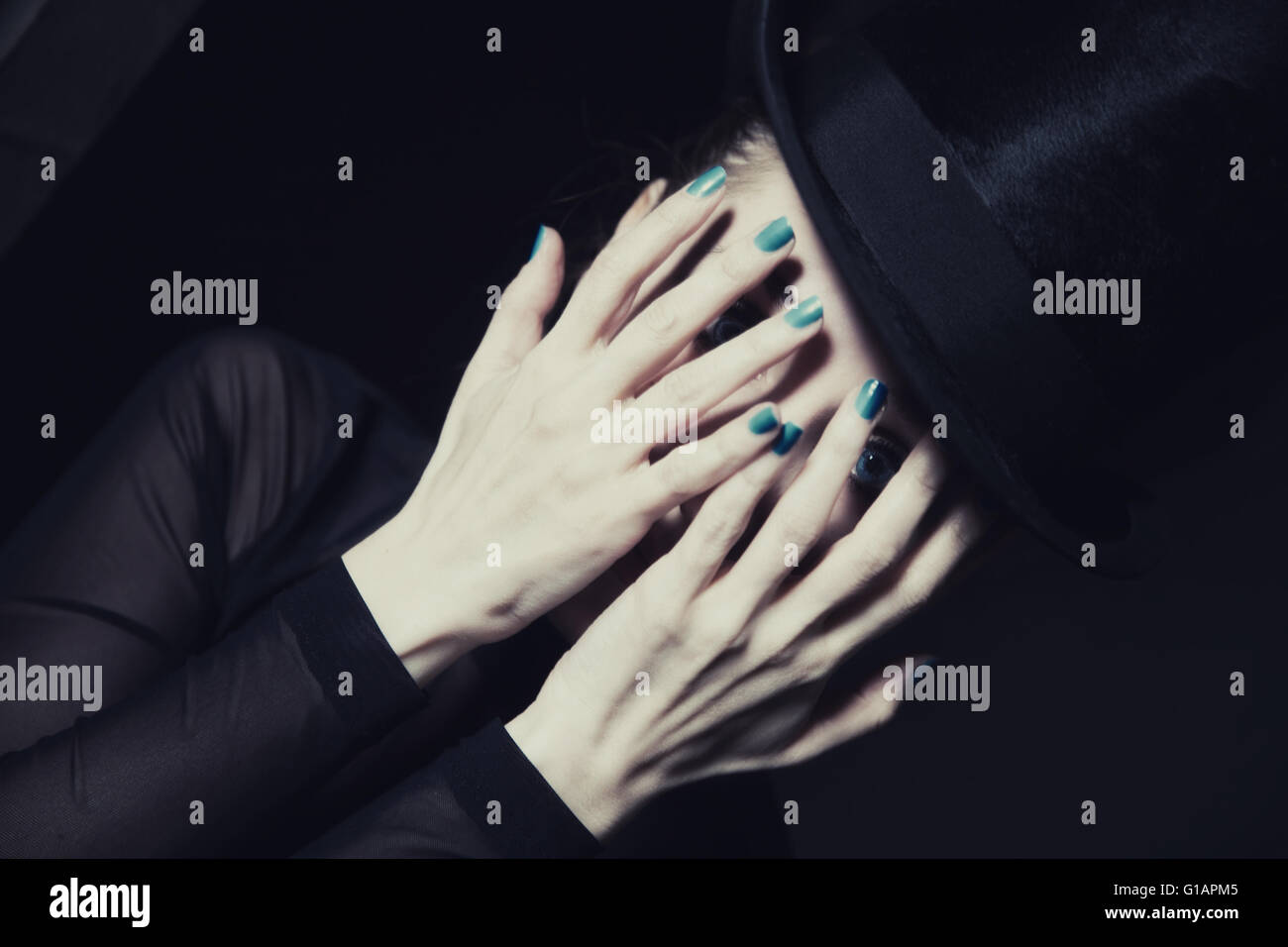 Portrait of beautiful young woman covering face with her hands Stock ...