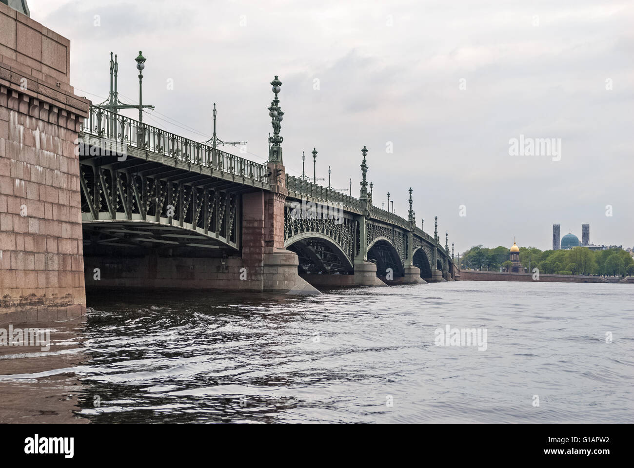 Kamennoostrovsky bridge over the river Neva in St. Petersburg with Muslim mosque and Orthodox chapel in the background. Stock Photo