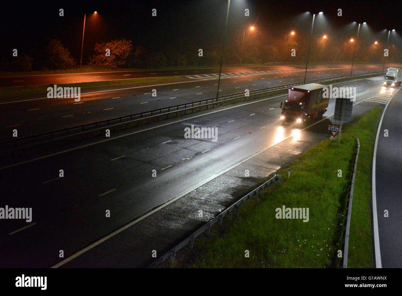 Royal mail heavy goods vehicle travelling on the M4 Motorway at night. Stock Photo