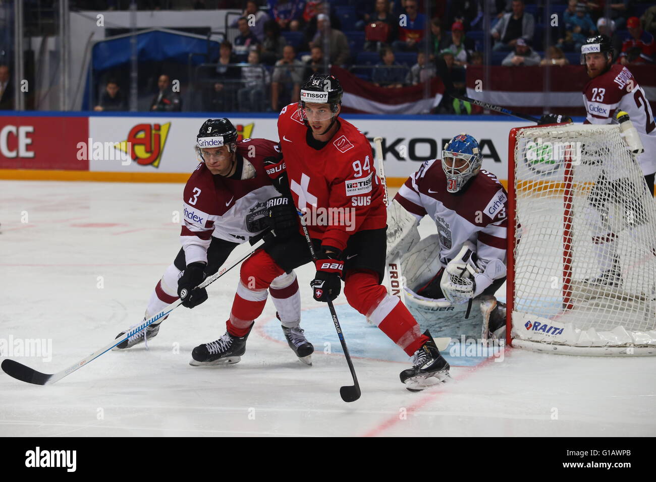 Moscow, Russia. 11th May, 2016. Samuel Walser of Switzerland (C) vies with Maksims Sirokovs (L) and Edgars Masalskis (R) of Latvia during an IIHF Ice Hockey World Championship Group A preliminary round game between Switzerland and Latvia in Moscow, Russia, on May 11, 2016. Switzerland won 5-4. © Evgeny Sinitsyn/Xinhua/Alamy Live News Stock Photo