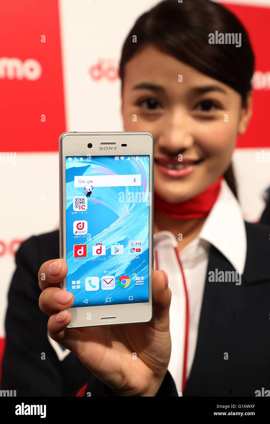 Tokyo, Japan. 11th May, 2016. A model displays Japanese mobile