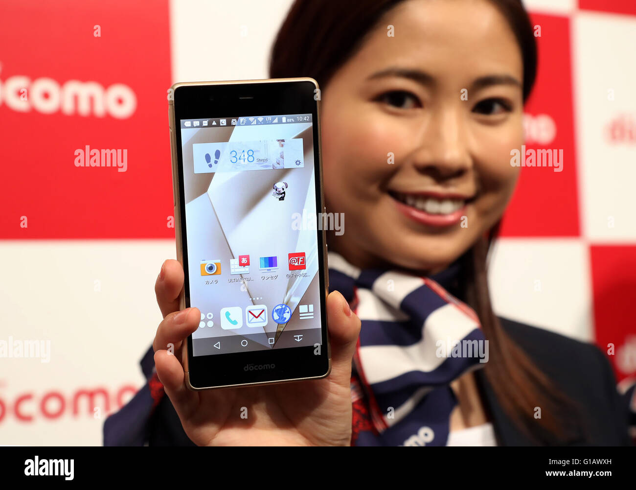 Tokyo, Japan. 11th May, 2016. A model displays Japanese mobile