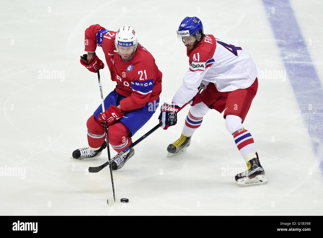 Moscow, Russian Federation. 12th May, 2016. From left: Morten Ask (NOR) and Tomas Filippi (CZE) in action during the Ice Hockey World Championships Group A match Czech Republic vs Norway in Moscow, Russia, on May 12, 2016. © Roman Vondrous/CTK Photo/Alamy Live News Stock Photo