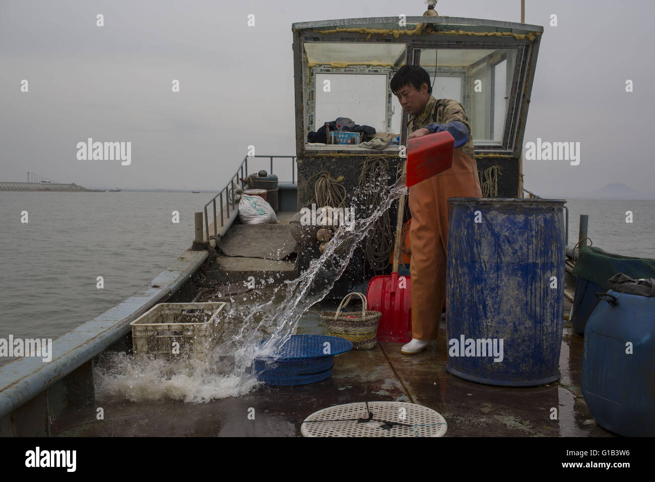 Xingcheng, Liaoning Province, China. 9th May, 2016. As China's coastal fishery resources are increasingly depleted in last two decades caused by pollution and overfishing, increasing costs of fishing have changed Chinese fishermen's life obviously. Many fishermen chose to sell their boats and completely give up the fishing life. The Bohai Sea is the source of marine fisheries resources in the North of China at before, but now, the sea has become almost empty and many species have become extinct. Wang Zhiqiang, a nearly 40-years-old fisherman who lives at Xingcheng city, in Liaoning provinc Stock Photo