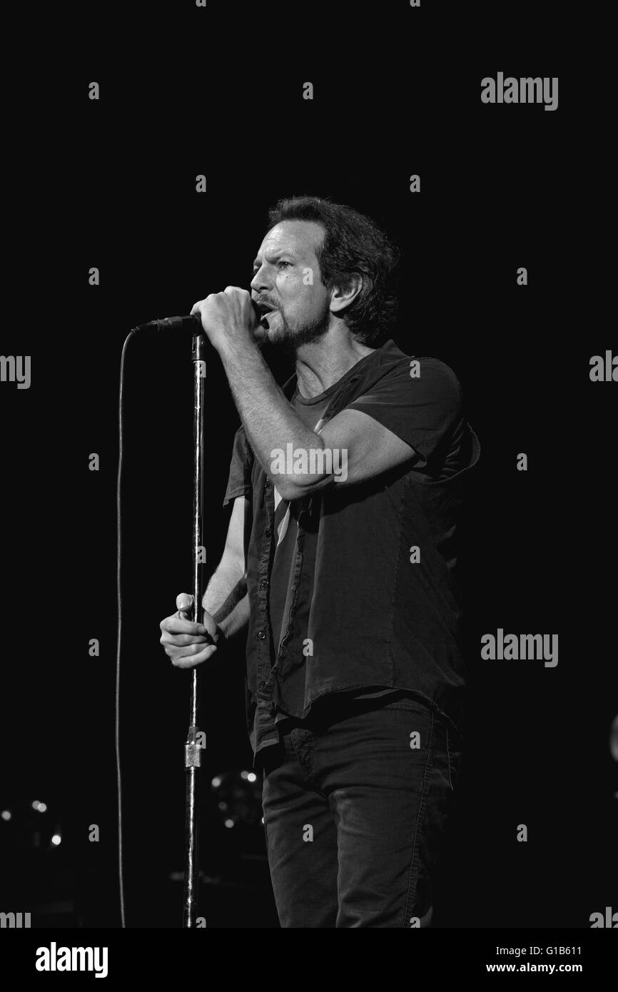 Eddie Vedder, lead singer of Pearl Jam standing a the microphone, performing at the Air Canada