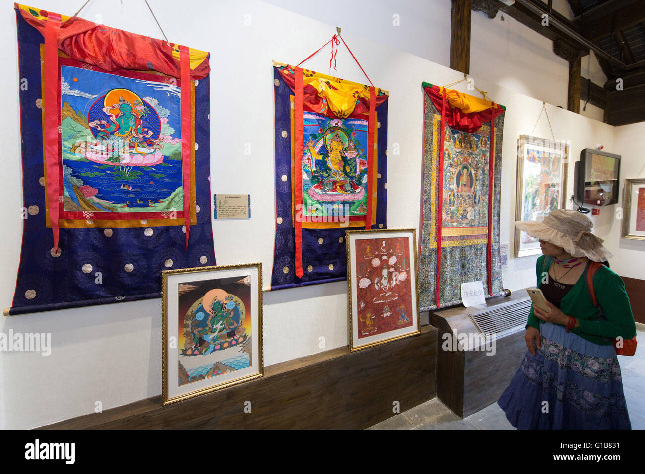 Nanjing, Nanjing, CHN. 12th May, 2016. Nanjing, China - May 12 2016: (EDITORIAL USE ONLY. CHINA OUT ) Thangka Exhibition from Gongka County Mozhu Yibet in Nanjing's Yu Garden. A thangka, variously spelt as tangka, thanka or tanka (Nepali pronunciation: [?t??a?ka]; Tibetan: ?????; Nepal Bhasa: ????) is a Tibetan Buddhist painting on cotton, or silk appliquÂ¨Â¦, usually depicting a Buddhist deity, scene, or mandala. Thangkas are traditionally kept unframed and rolled up when not on display, mounted on a textile backing somewhat in the style of Chinese scroll paintings, with a further silk cover Stock Photo