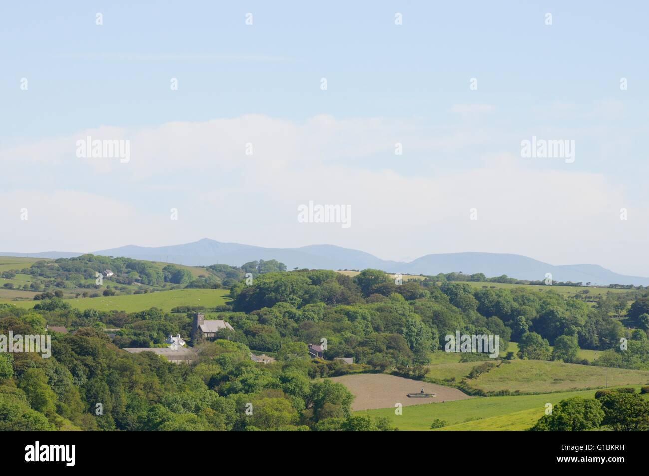 Cadair Idris from Mid Ceredigion wih Llandeiniol chapel in the foreground, Wales, UK Stock Photo