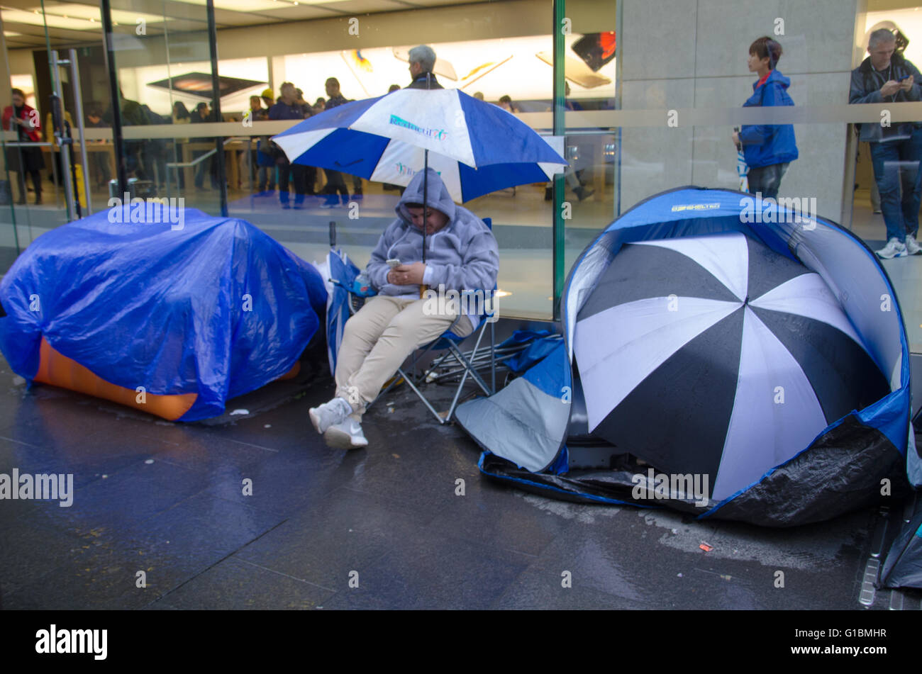 Sydney, Australia - 24th September 2015: Fans line the outside of Sydney's Central Business District Apple store with tents waiting for the new phone launch. The iPhone 6S officially launches on the 25th of September 2015. Stock Photo