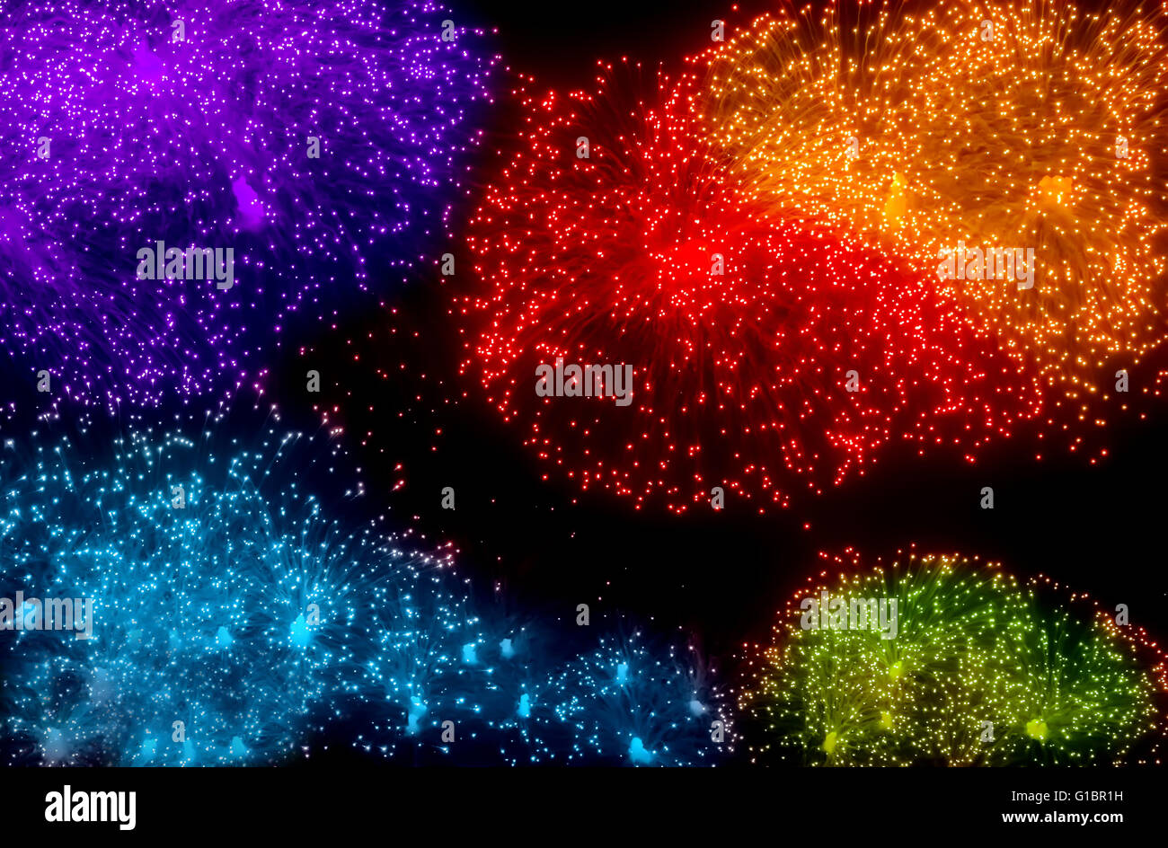 Big nice colorful bursts of fireworks in dark sky Stock Photo
