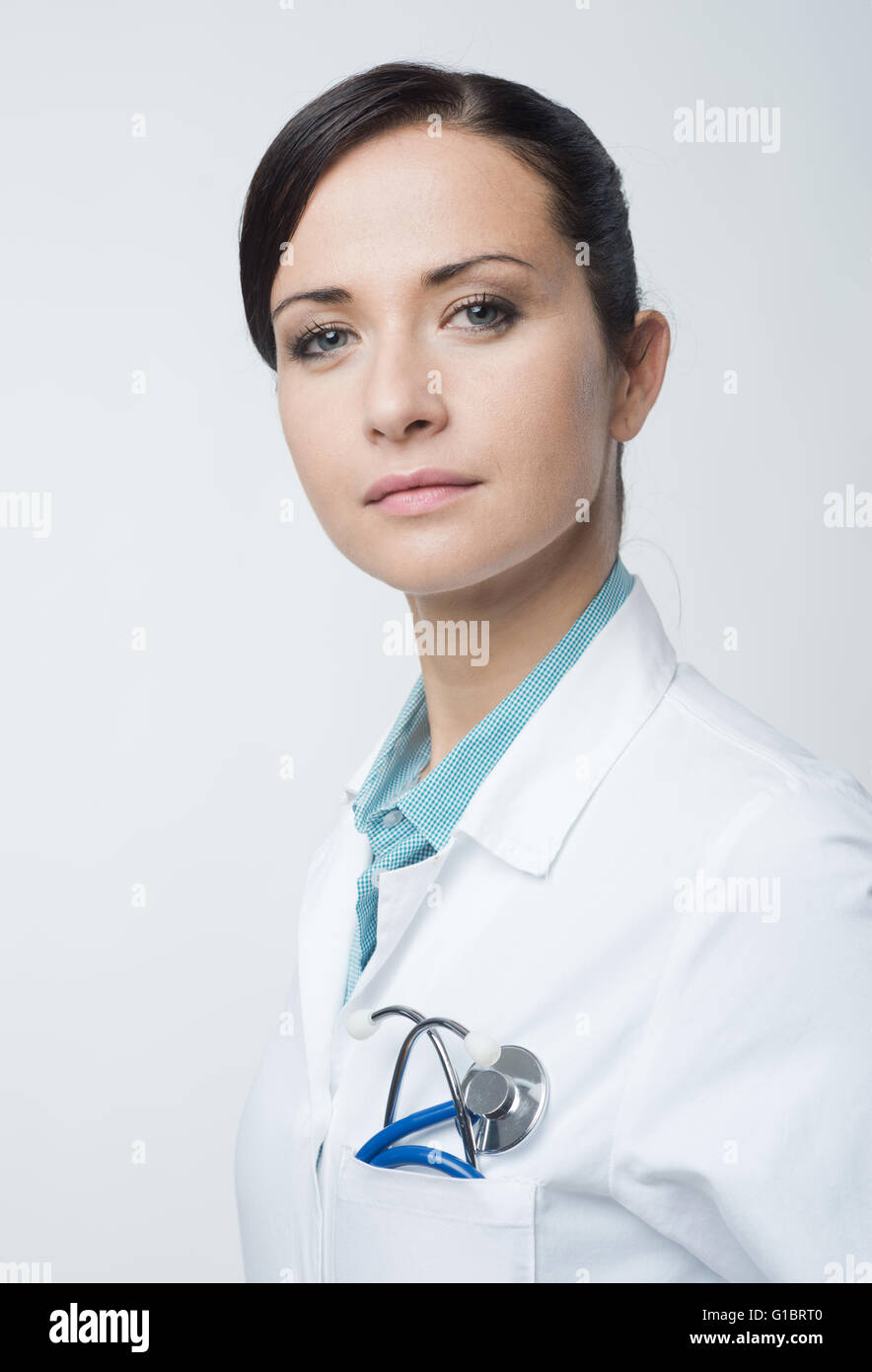 Smiling Confident Female Doctor Portrait With Lab Coat And Stethoscope