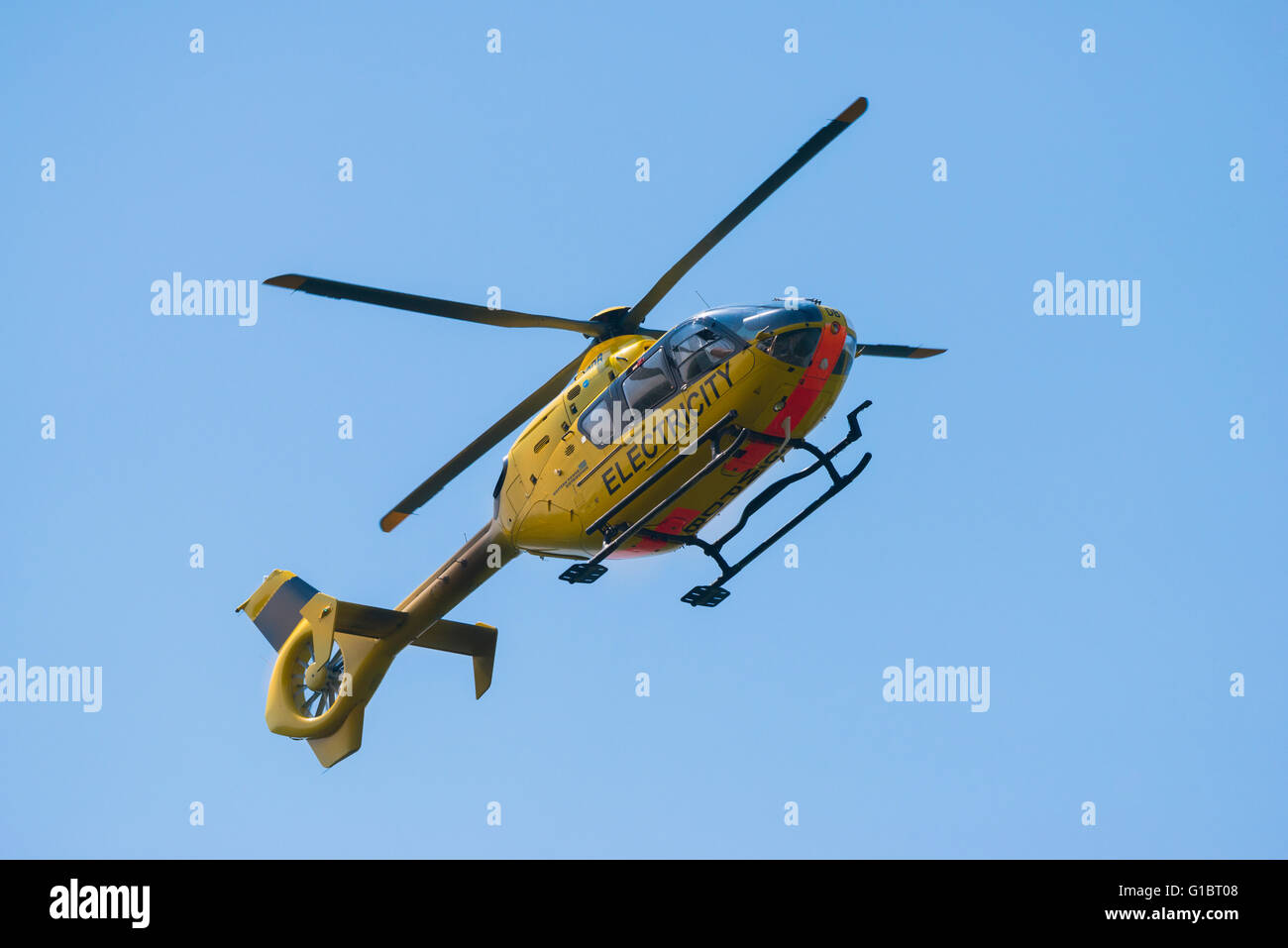 Western Power Distribution EC135 helicopter surveying power lines in ...