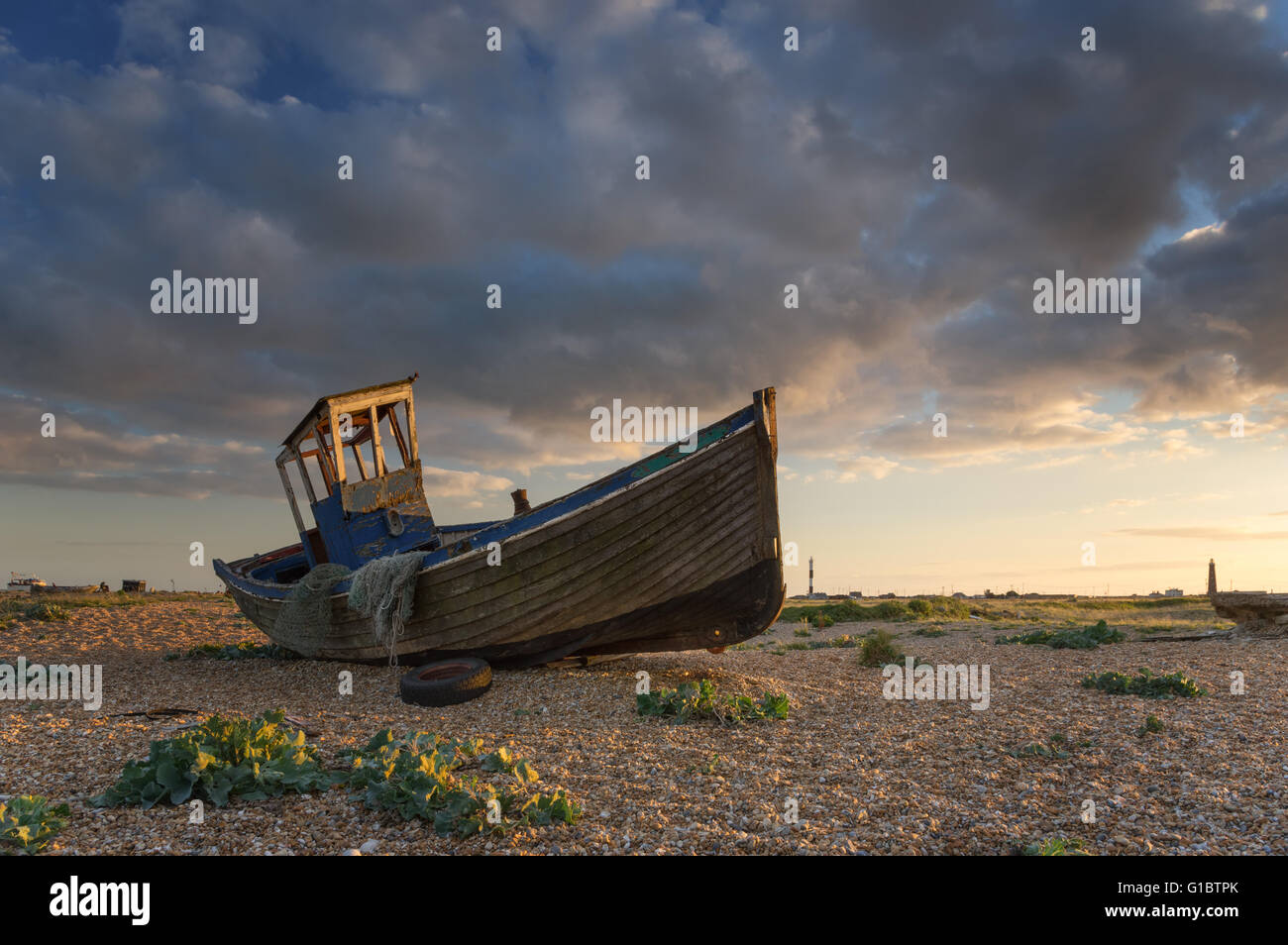 Old wooden boat on beach sunset hi-res stock photography and images - Alamy
