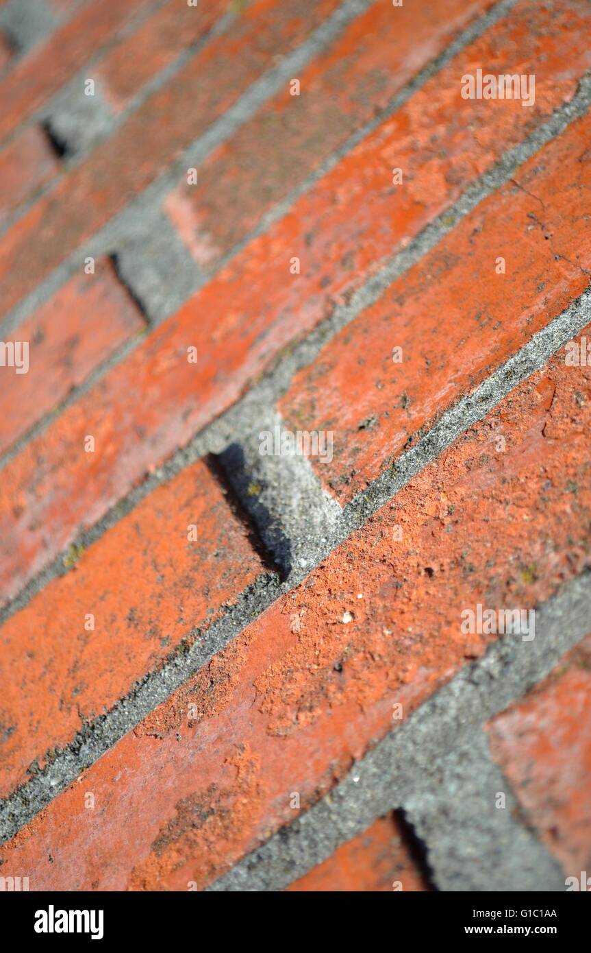 Brick wall in close up and in perspective. Vertical image. Selective focus Stock Photo