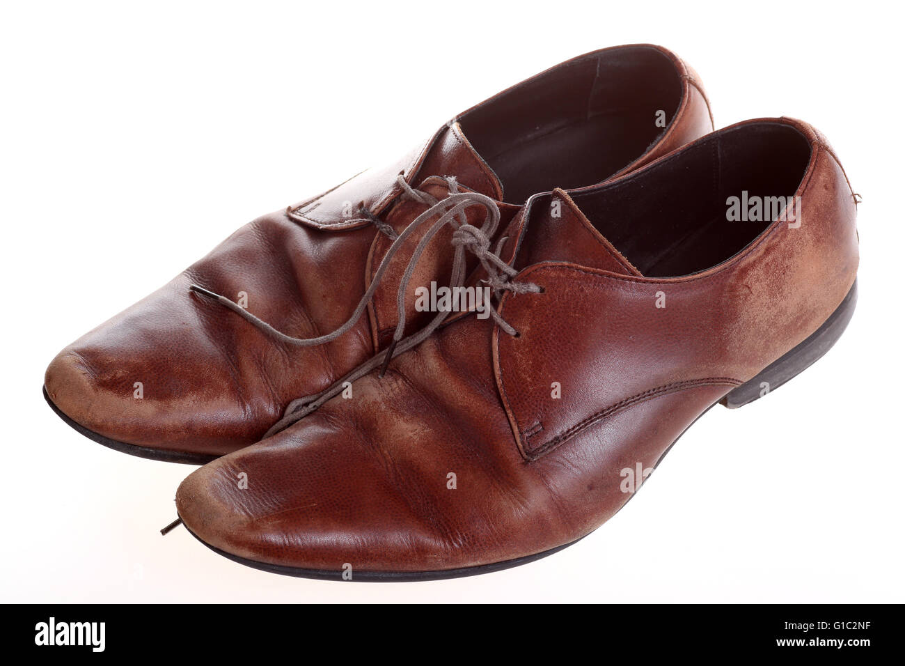 Very old and worn brown mens formal fashionable shoes. May 2016 Stock Photo  - Alamy