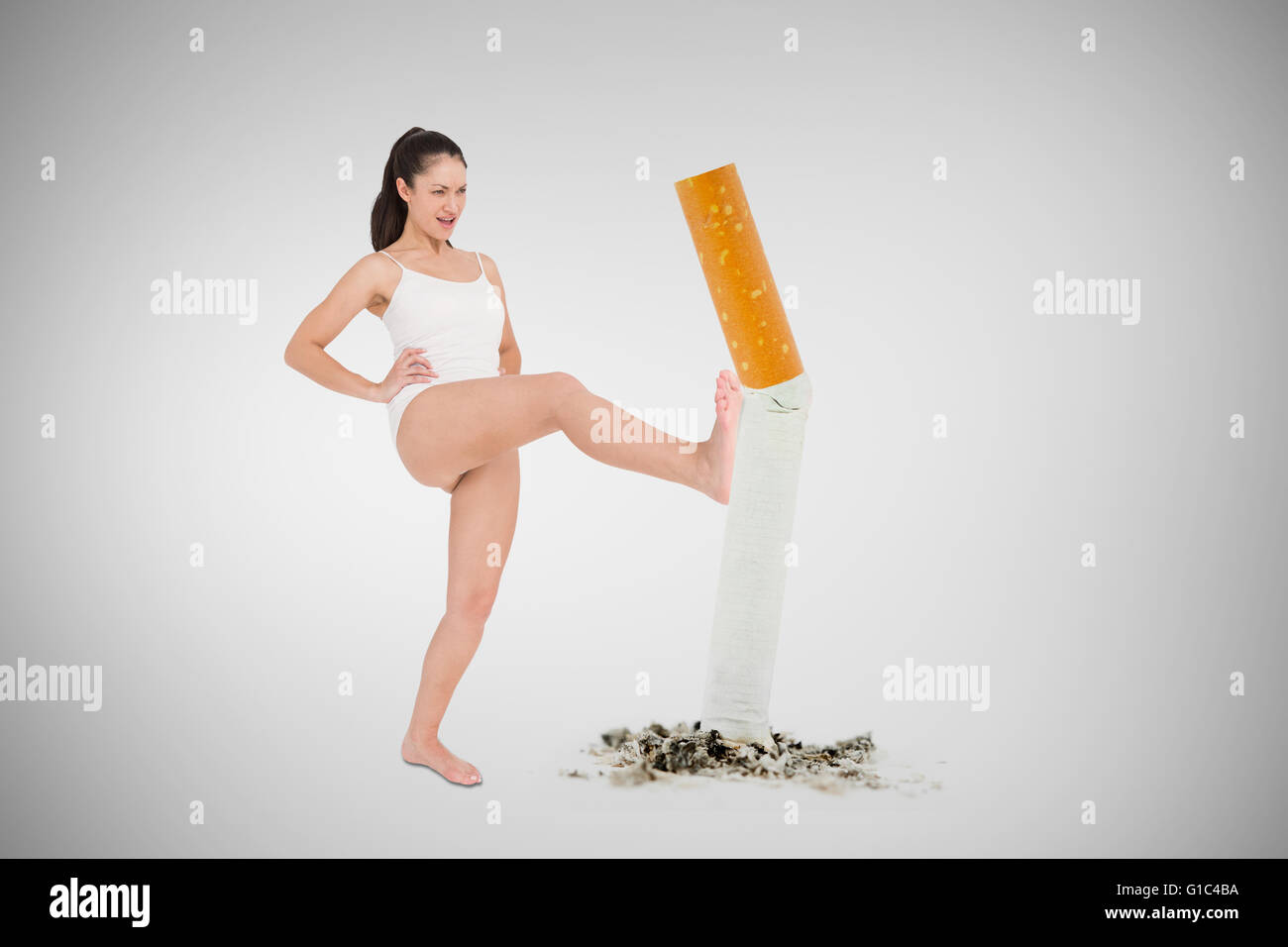 Composite image of fit woman practicing karate Stock Photo