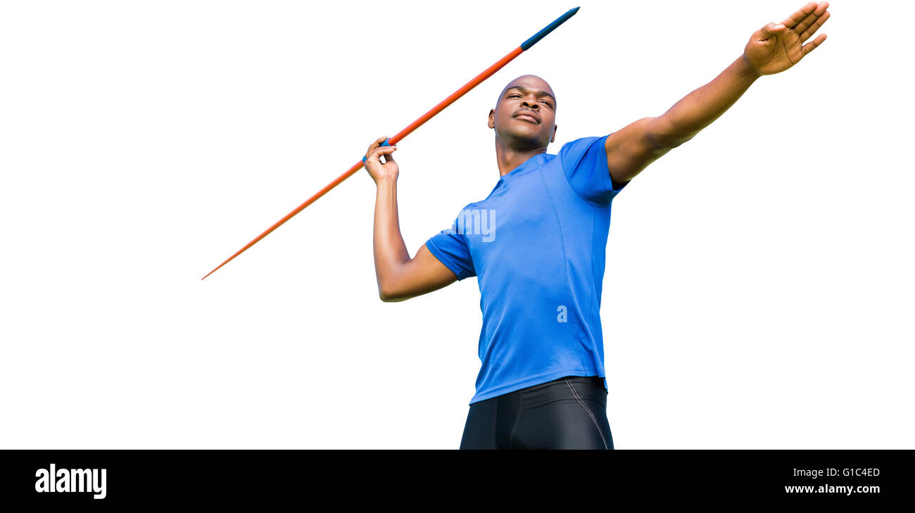 Concentrated sportsman practising javelin throw Stock Photo