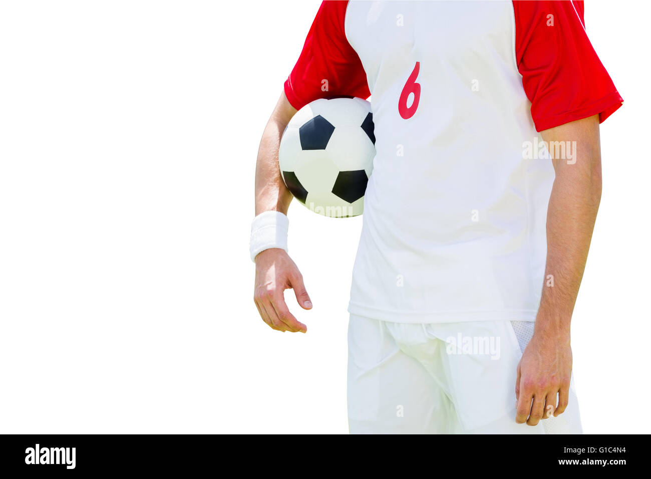 Man soccer player holding a ball Stock Photo