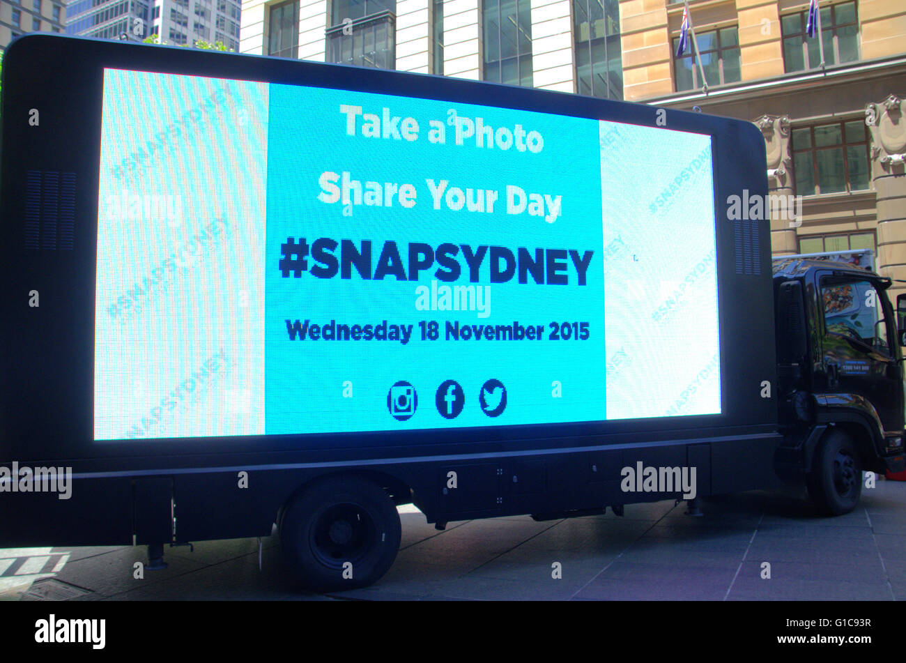 Sydney, Australia - 18th November 2015: #snapsydney photography event  in Sydney's Martin Place. Pictured is an electronic billboard showing images from instagram that were tagged with #SNAPSYDNEY Stock Photo