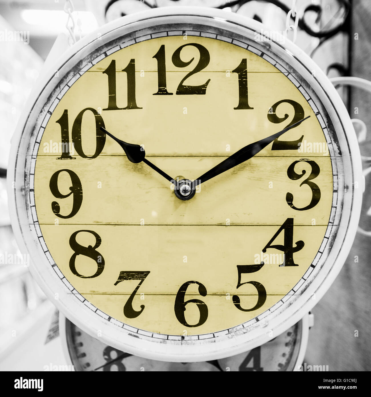 Detail of yellow clock in a classical style. Stock Photo