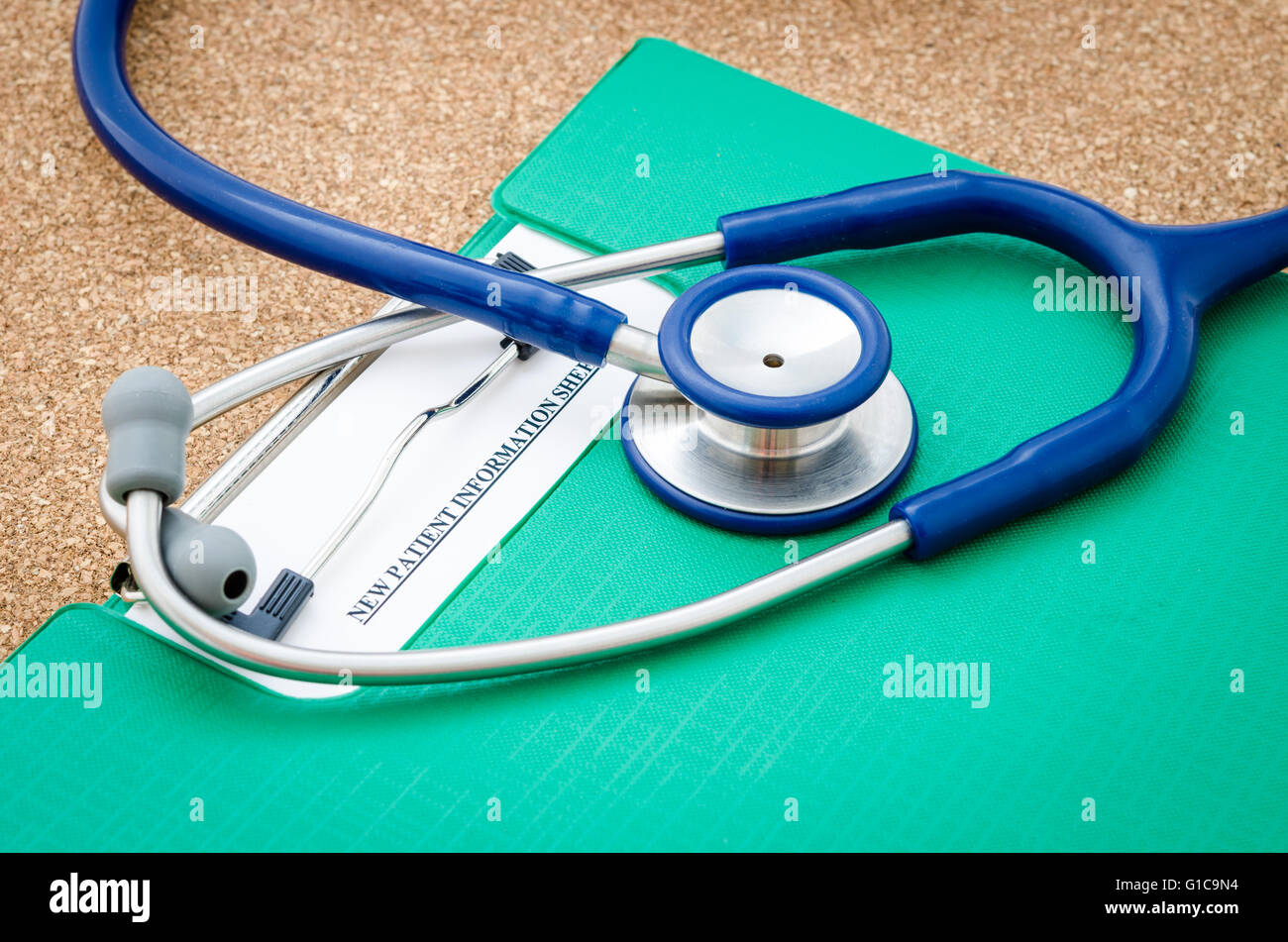 New patient record form with stethoscope medical on wood table. Stock Photo