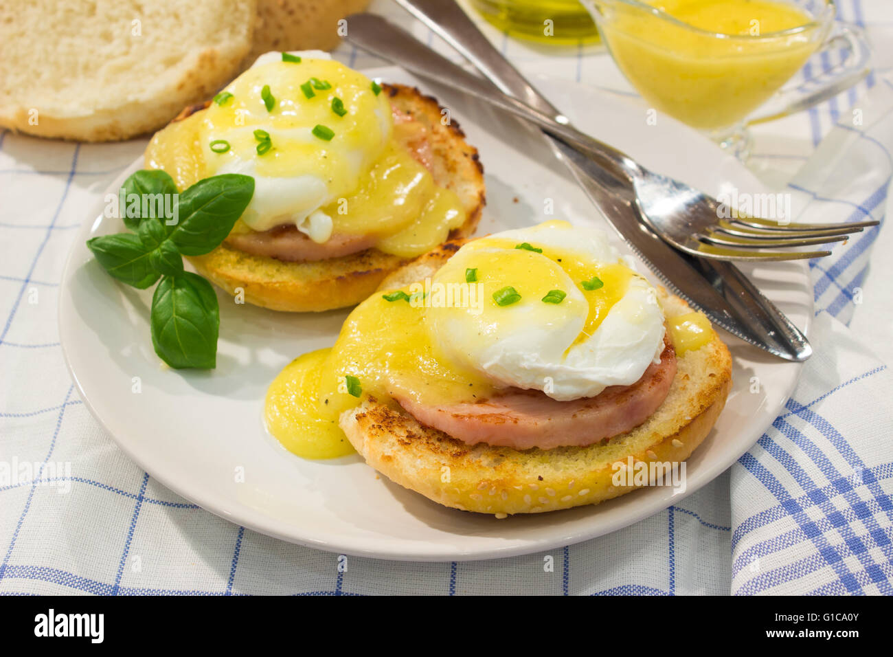 Egg Benedict with roasted ham, toasts and fresh hollandaise sauce Stock
