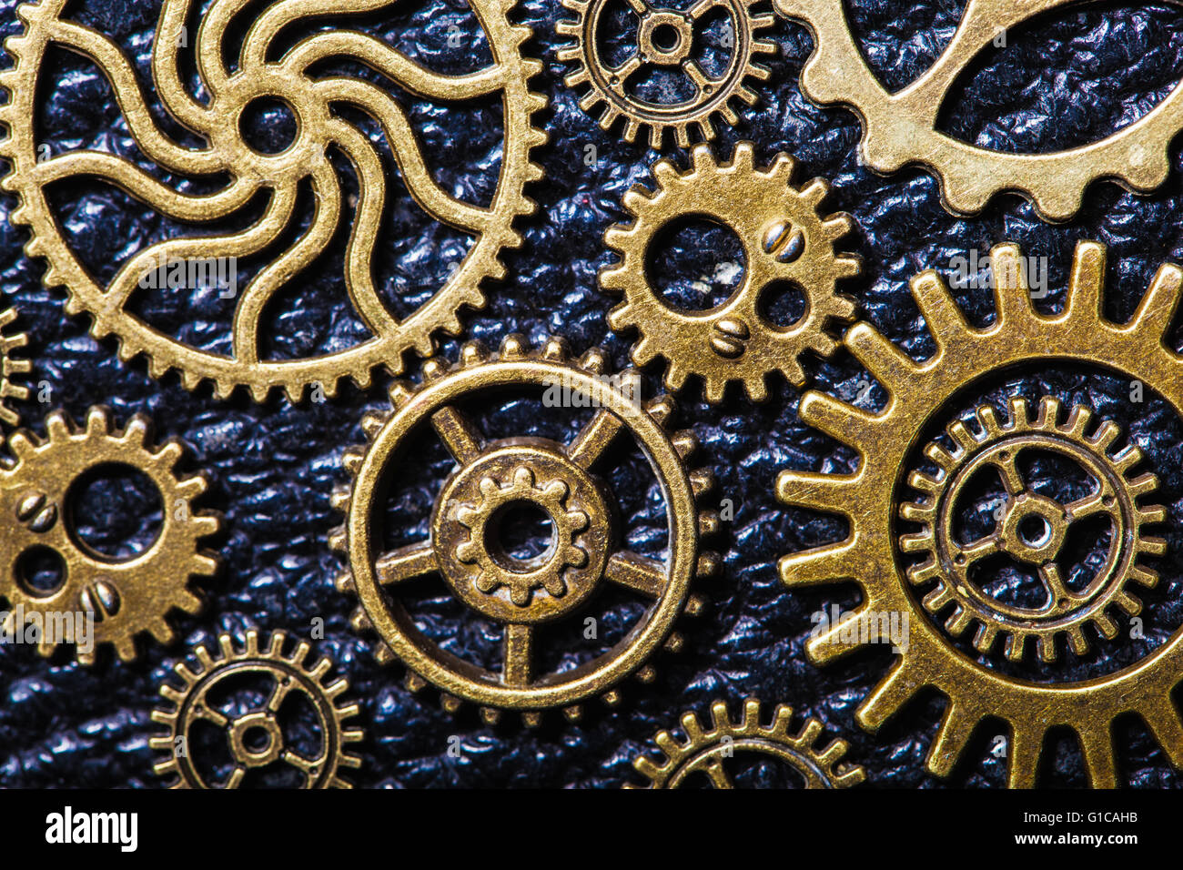 steampunk mechanical cogs gears wheels on leather background Stock