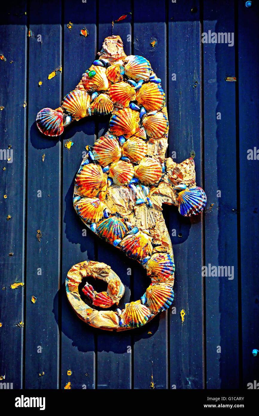 North Shields funny mussel and scallop shell seahorse on blue door Stock Photo