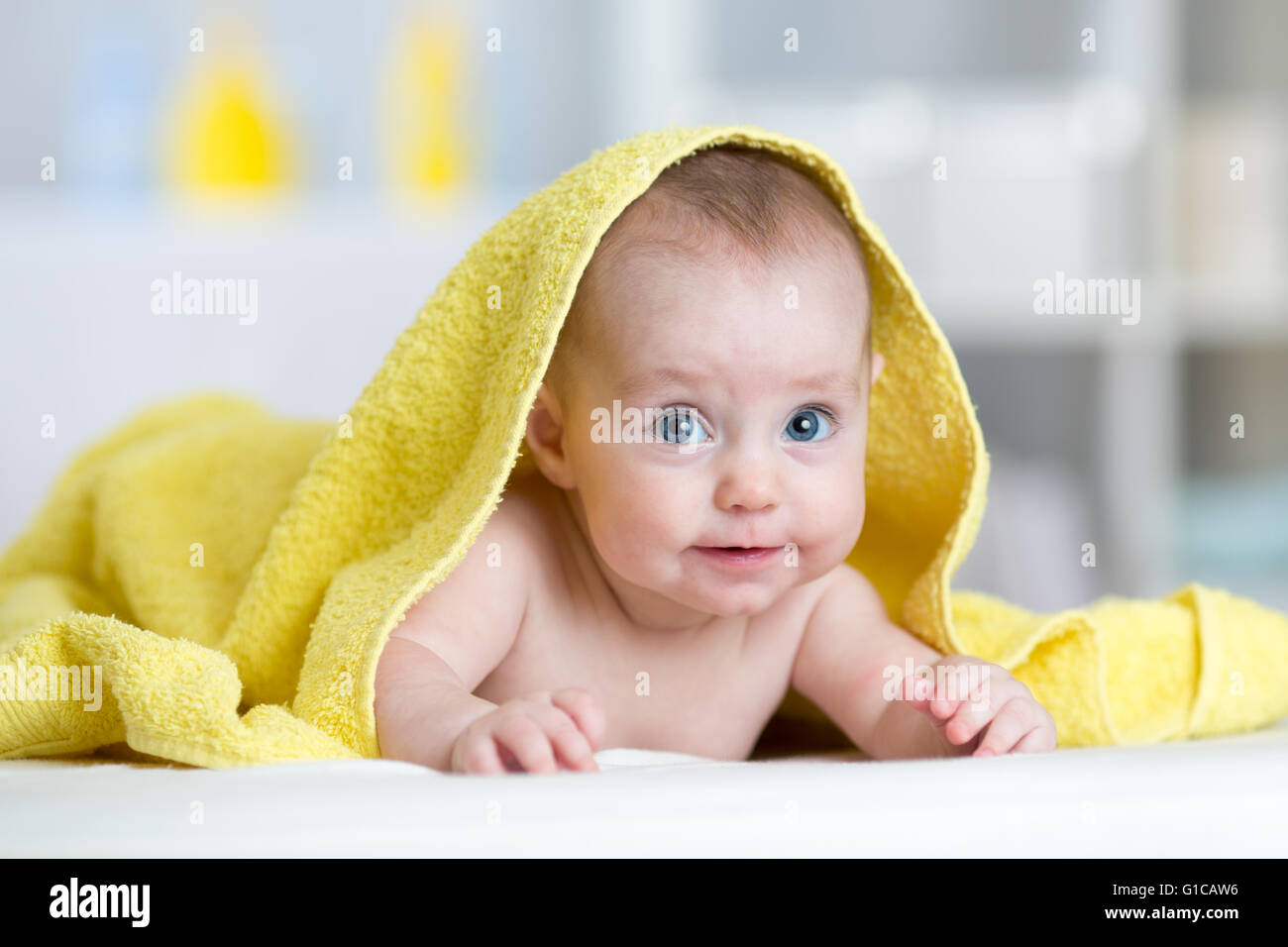 Smiling baby after shower or bath with towel on head Stock Photo Alamy