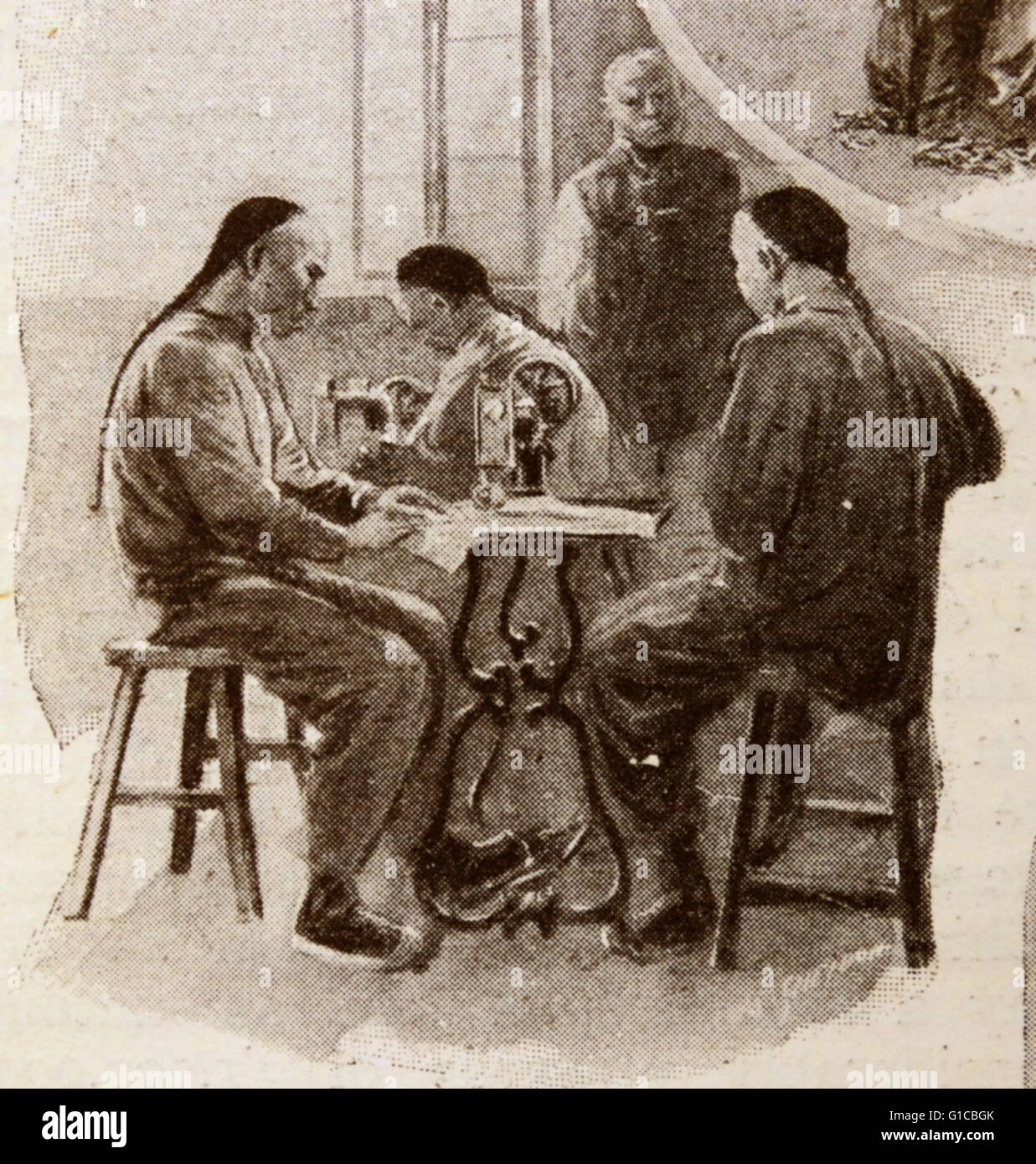illustration depicting Chinese tailors with a sewing machine 1890 Stock Photo