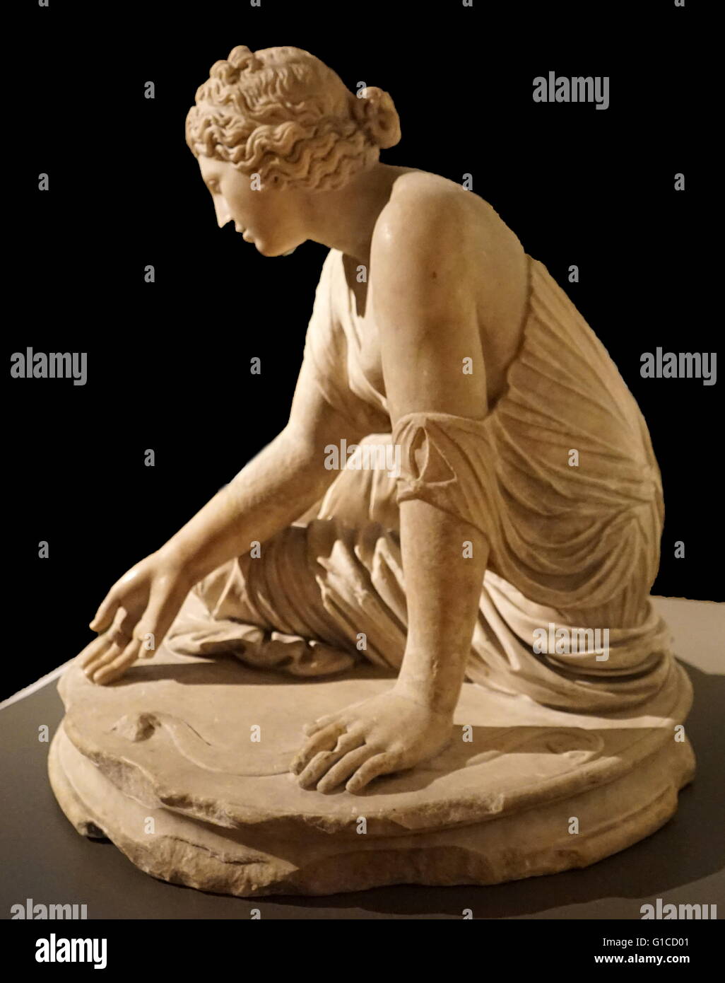 Marble statue of a young Roman girl playing Knucklebones, also known as Fivestones or Jacks, Dated 2nd Century AD Stock Photo