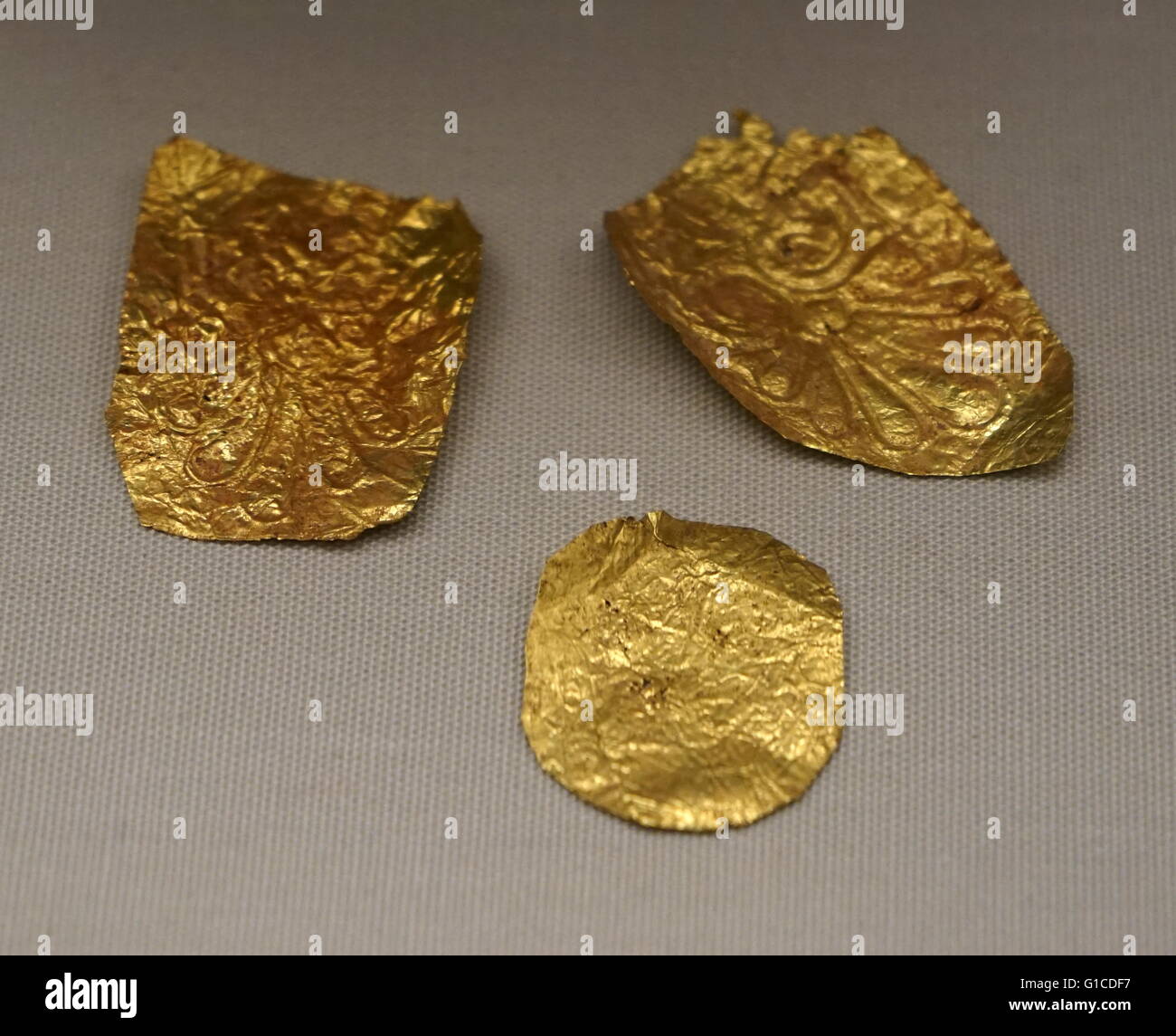 Embossed decorative gold fragments from ancient Greece. Stock Photo