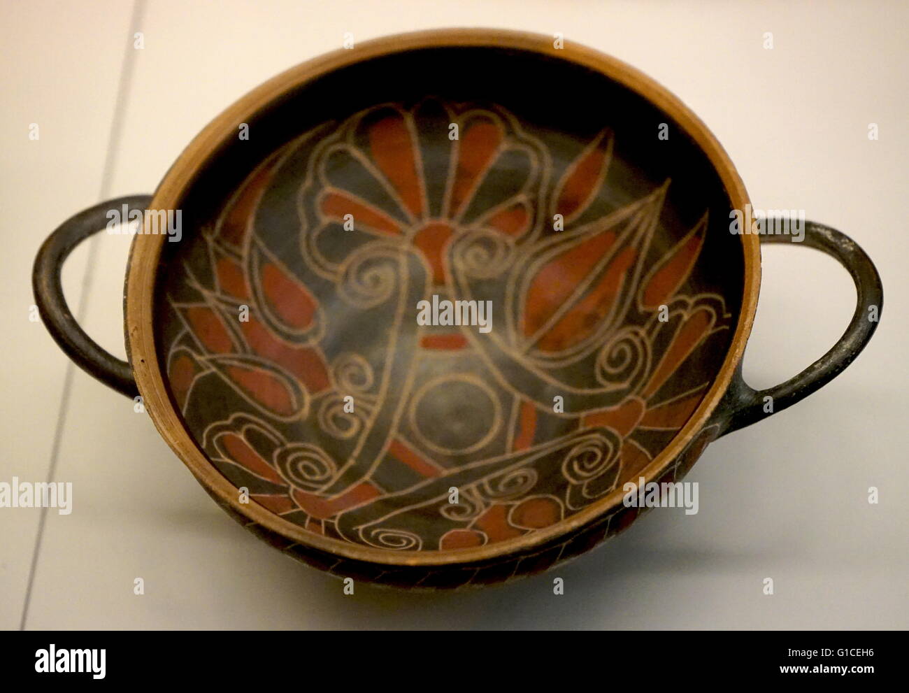 Bronze vroulian cup, decorated with incised florals with added red paint from Kamiros, Rhodes. Dated 600 BC Stock Photo