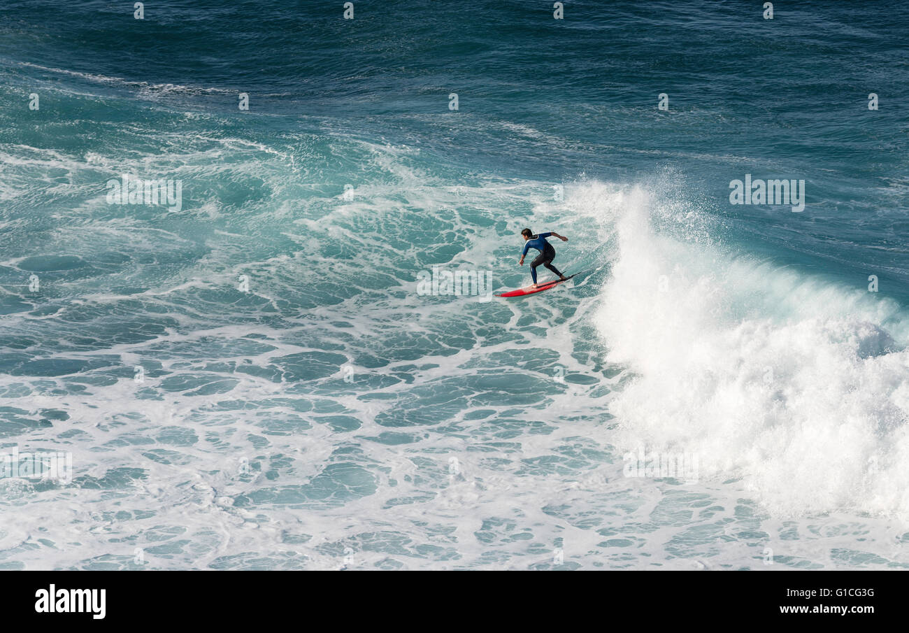 SAO VINCENTE,PORTUGAL-MARCH 24 Unidentified boy surfing on the big waves at the north coast of Madeira on MArch 23,2016 in Sao V Stock Photo