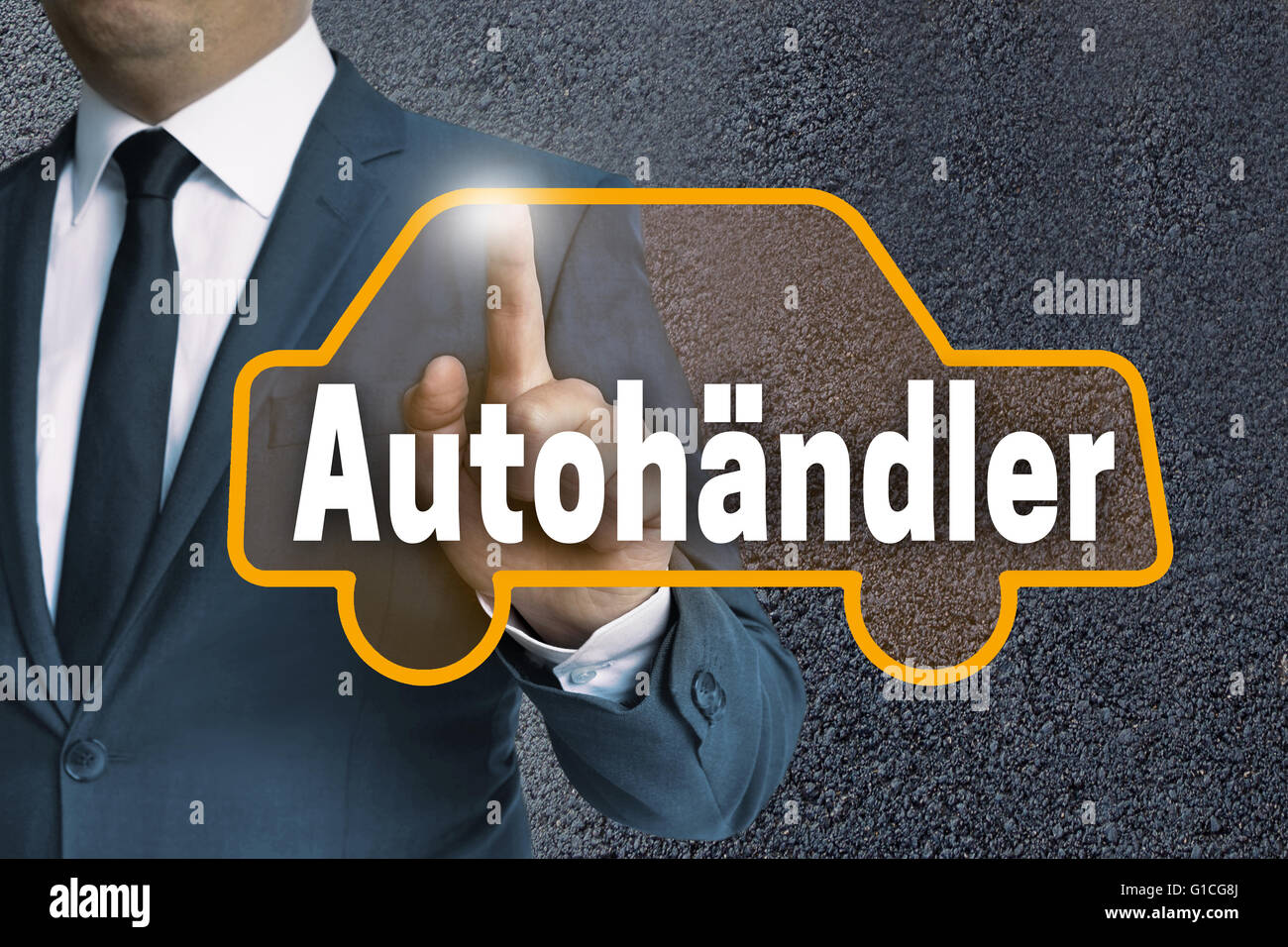 autohaendler ( in german car dealer) auto touchscreen is operated by businessman concept. Stock Photo
