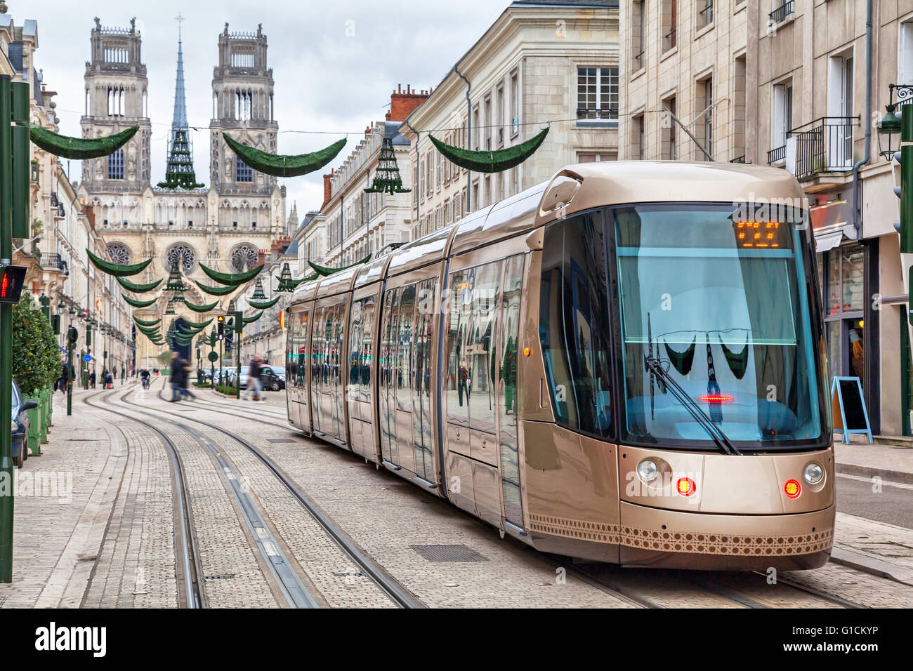 Brown tram on Rue Jeanne d'Arc in Orleans, France Stock Photo