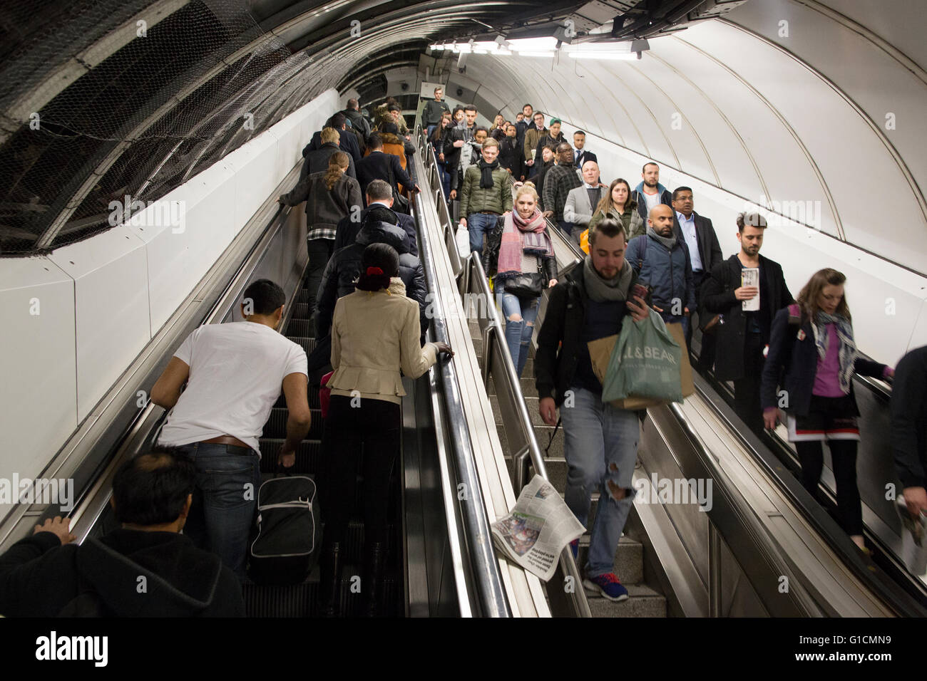 Commuters traveling up the escalator at Bank tube station, London, UK Stock Photo