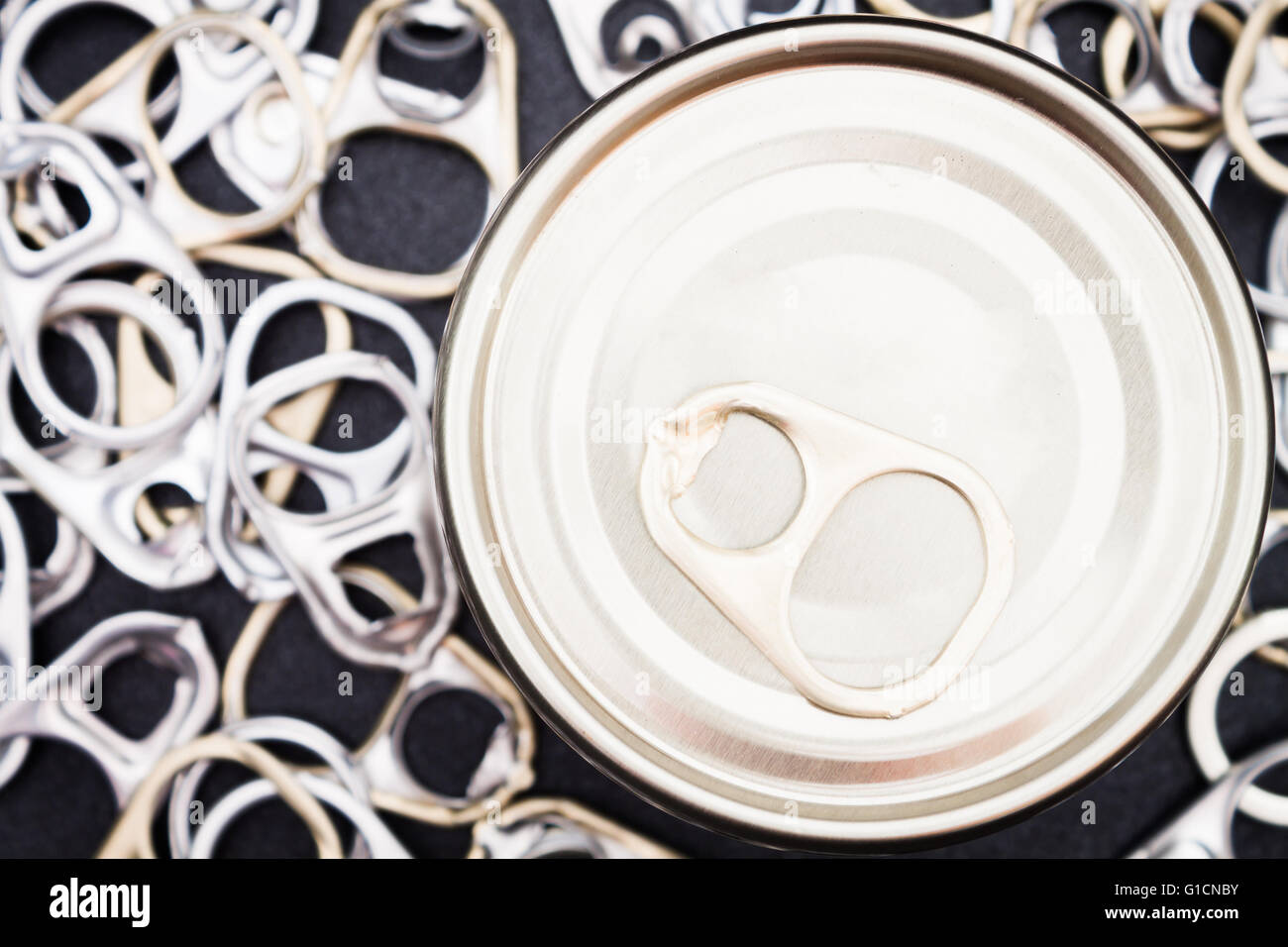 Ring pull cans opener on black metallic background Stock Photo Alamy