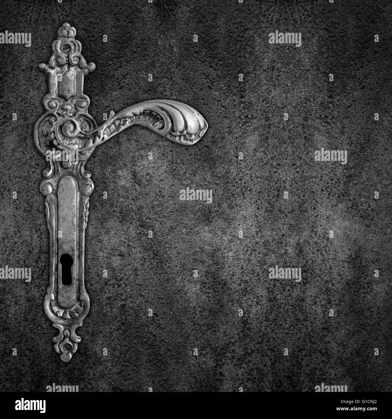 old handle on black plate background or vintage iron door Stock Photo